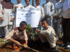 Jabal (left) taking the lead in planting trees