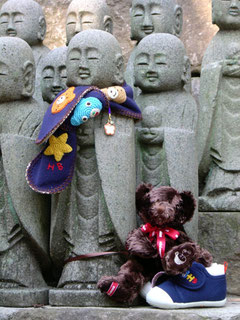 A clothed Jizo statue