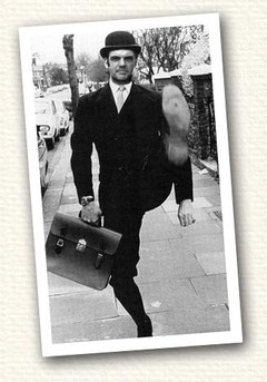 Steve Hartley as Minister of Silly Walks with briefcase and bowler.