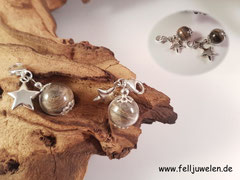 CH 4: Glasperle 16mm gefüllt mit Tierhaaren, Perlkappen, einem silbernen Stern und Krabiner zur Befestigung. Alle silbernen Elemente sind aus 925er Silber. Preis: Stück 35 Euro