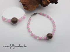 AB 17: Glasperle in 16mm gefüllt mit Tierhaaren, klare Crackelperlen und rose farbige Polarisperlen mit einem Verschluss aus Edelstahl. Preis: 43 Euro
