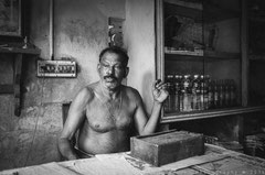 the cashier, Kainakeri village, Kerala, 2013