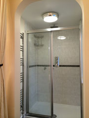 Back in Brighton, the en suite shower room required redecoration and regrouting of tiled area