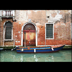 BLUE SKIFF (Quiet scene in a small canal in Venice, Italy)