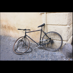 GOING NOWHERE (Non-functioning bicycle carefully locked on side street in Rome, Italy)