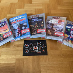 Das Bild zu Männerquatsch Podcast Folge 201 zeigt diverse neue Spiele für das Atari 2600+ und das Atari 7800+. 