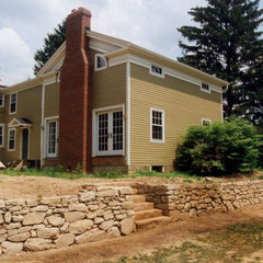 Construction complete; wall built to match Western Reserve style of architecture of residence.