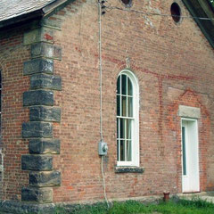 Restoration complete with matching salvaged brick and lime mortar to match original construction.