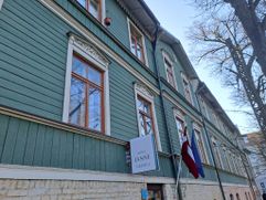 Facade of two-story timber Hotel Janne in Riga's Āgenskalns district