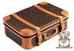 Sold at Auction: LOUIS VUITTON Valise Cuir de veau Taïga noir Garniture  métal argenté Dimensions : 35 x 48 x 18 cm Set clés/cadenas