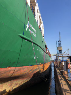 red vessel loading cargos