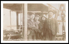 Workers on board H.M.S. Montagu after it being wrecked.