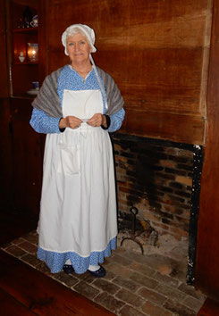 A Costumed Interpreter by the Hearth