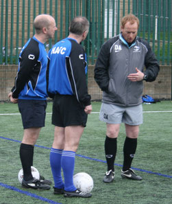 Daz (right) in deep discussion with a Management Team