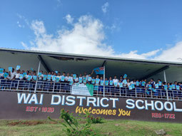 Group picture taking with a hand book on environmental conservation in hand