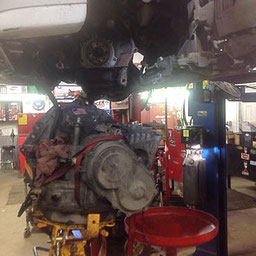 Replacing a car engine in the CMR Rebuild shop