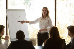 Female speaker give flip chart presentation at conference training meeting von fizkes