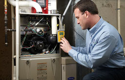 Technician conducts a furnace maintenance service