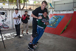Skateboard legend Tony Hawk with sponsored child through CCF 