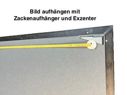 Bild aufhängen mit Exzenter. 