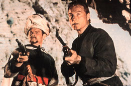 Robert Siodmak inszenierte 1964 den Film „Der Schut“ mit Ralf Wolter als Hadschi Halef Omar (links) und Lex Barker als Kara Ben Nemsi. Picture Alliance