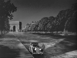 John Wayne in a matte shot of "Reunion in France", including the Paris landmark, Arc de Triomphe. 