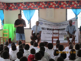 Before planting trees, OISCA staff lectures to students about the meaning 　of activity and how to plant trees. 