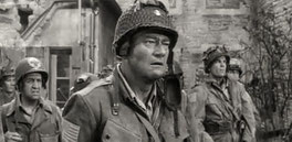 John Wayne shoots the Sainte-Mère-Eglise sequence in "The Longest Day" in an elaborate set in the Paris Studios de Boulogne.