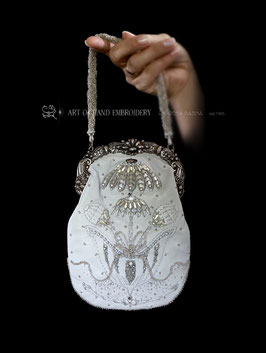 Hand embroidered leather handbag