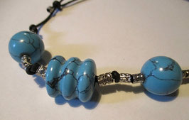 Necklace in silver end turquoise on a fabric cord