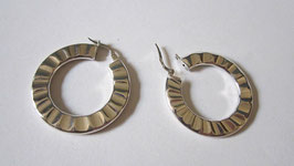 Hoop silver earrings slightly wavy