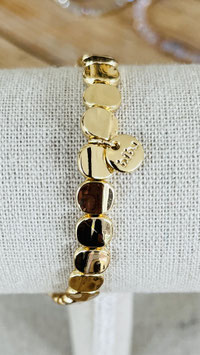 Biba Armband goldfarbene, flache, glänzende, ovale Scheiben