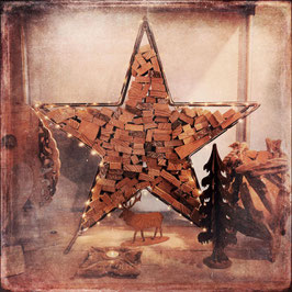 Metalen ster met haardhout
