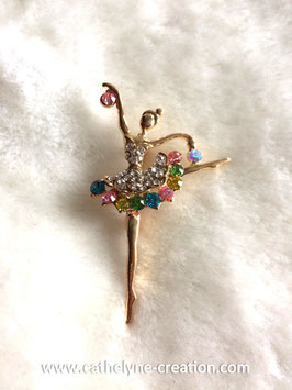 Broche danseuse dorée et stressée