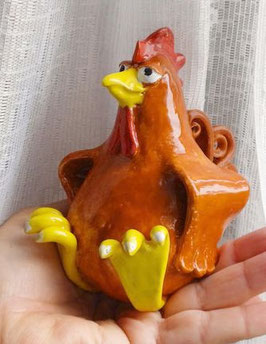 lustiges, sitzendes Huhn