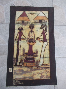 Batik africano con capanne sullo sfondo
