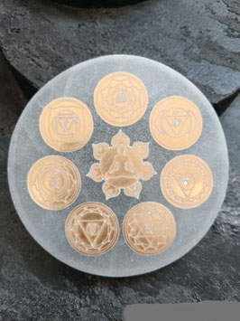 Disco selenite con chakra dorati