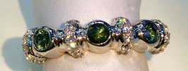 Ring wth 3 green sapphires, 0,49 ct. and 24 CZ-diamonds