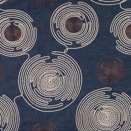 Denim met geborduurde circels