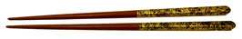 Baguettes bois, Fils d'or sur fond noir