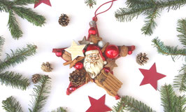 Roter Dekostern mit Weihnachtsmanngesicht
