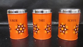 3 vintage oranje Brabantia voorraadbussen met bloemdesign