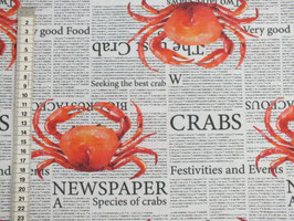 Dekostoff mit Hummer auf Zeitung
