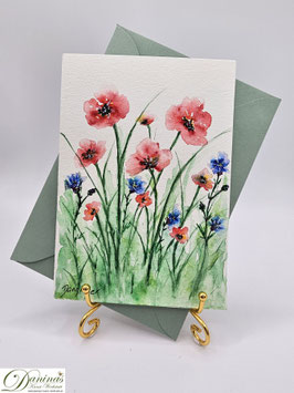 Mohnblumenwiese mit Kornblumen