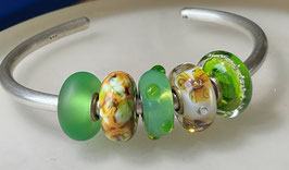 5 green/amber beads