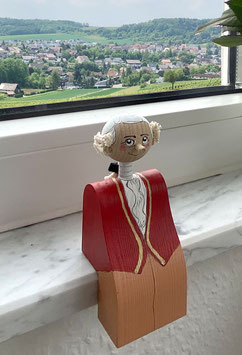 Wolfgang Amadeus Mozart Figure as an Edge Sitter
