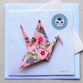 Carte grue origami rose et kokeshi sur papier blanc paillettes or