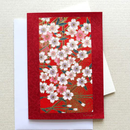 Carte de voeux fleurs de cerisiers blanches, roses et or sur carte rouge