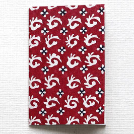 Carnet de poche plumes en spirales blanches fond rouge