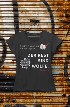 Damenshirt schwarz „Der Rest sind Wölfe“ - mit Österreich ist Frei Logo am Ärmel